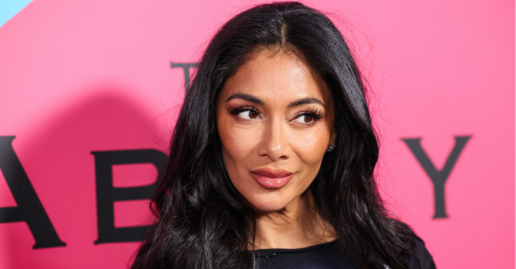 Nicole Scherzinger poses in a black t-shirt