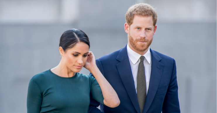 Meghan Markle and prince Harry look downcast