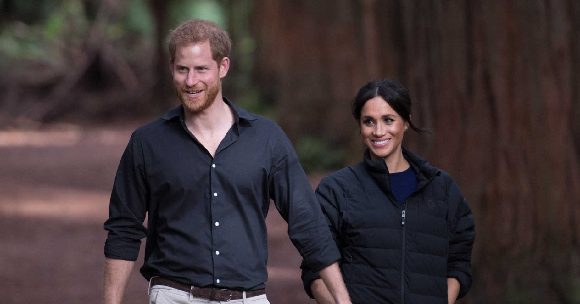 Prince Harry holds hands with Meghan Markle