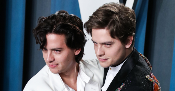 Dylan and Cole Sprouse embrace each other