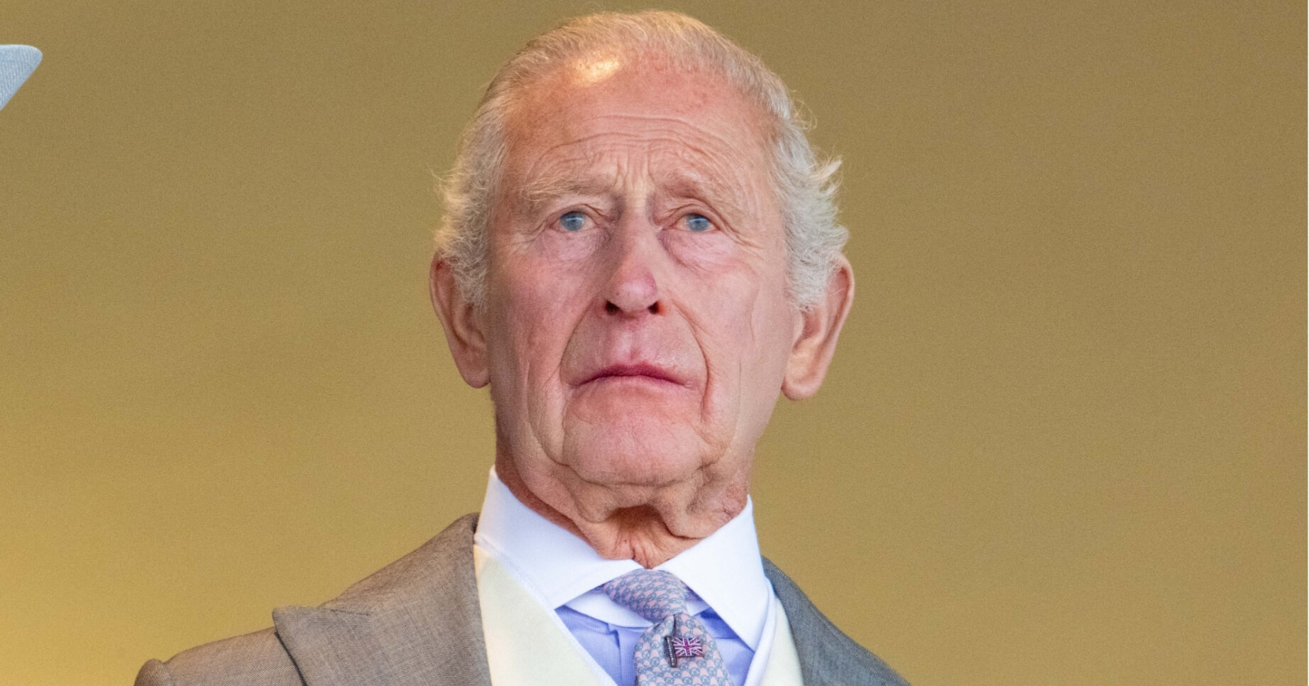 King Charles looks solemn