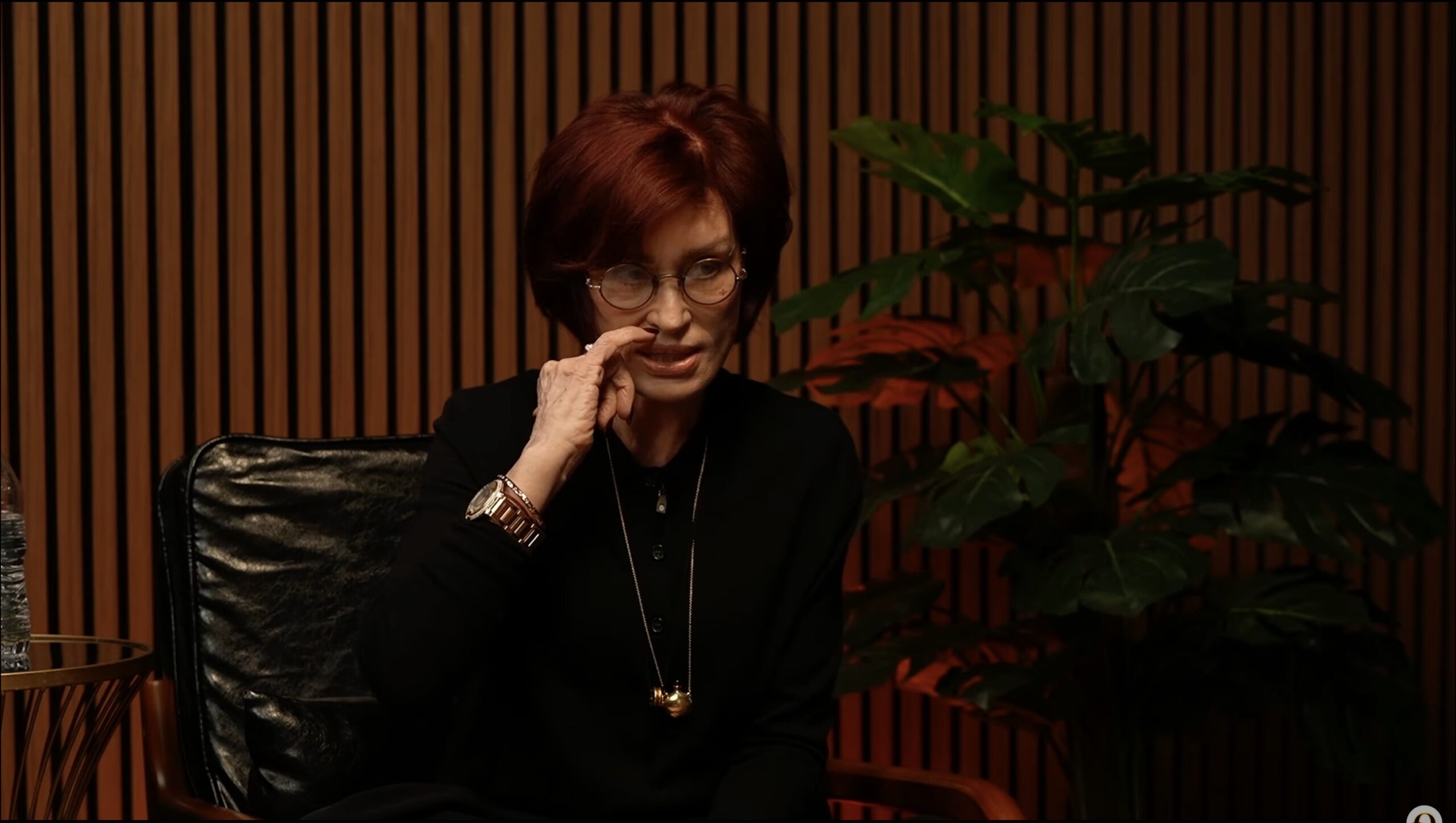 Sharon Osbourne pointing to dent in face