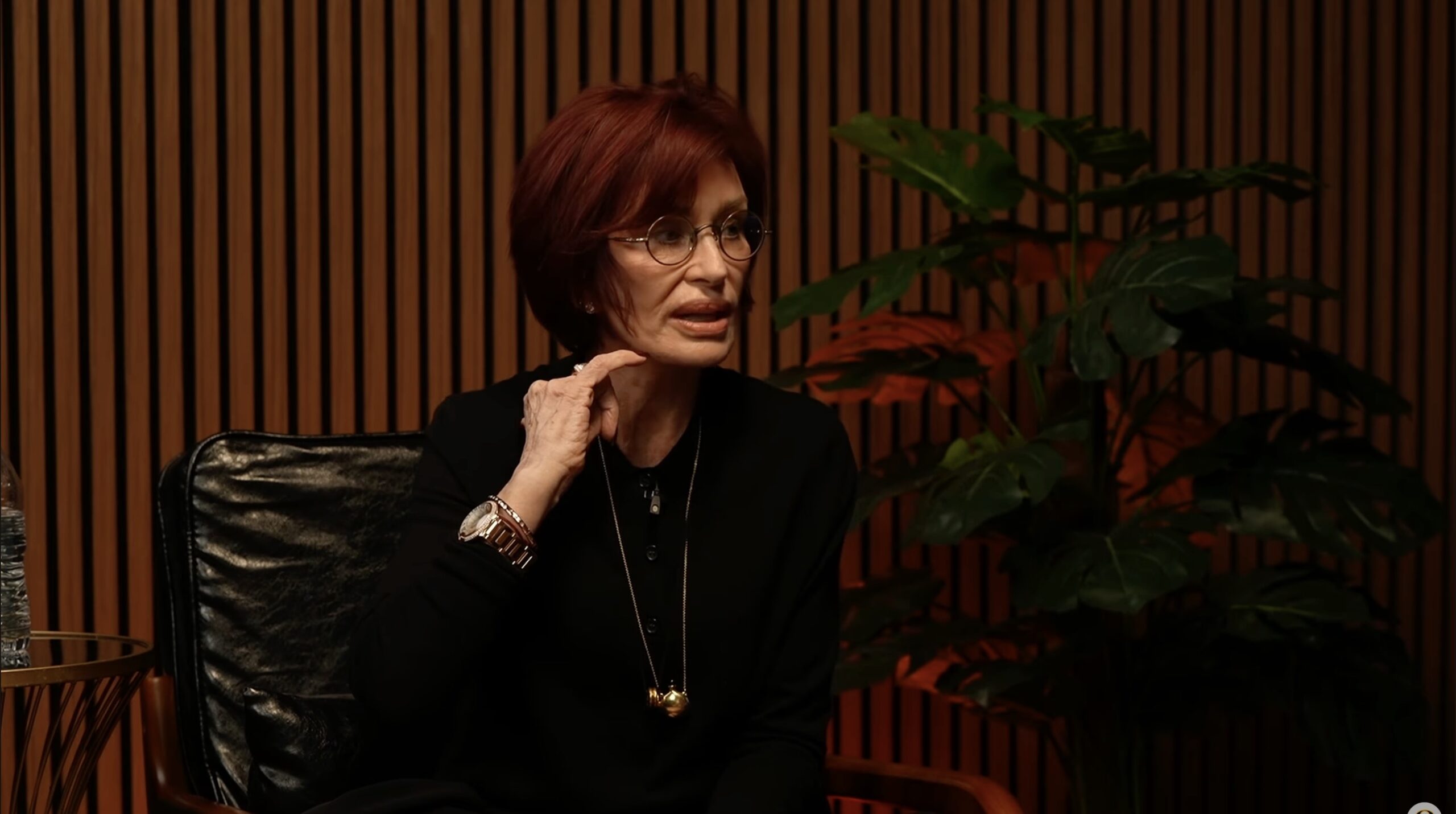 Sharon Osbourne pointing to dent in face