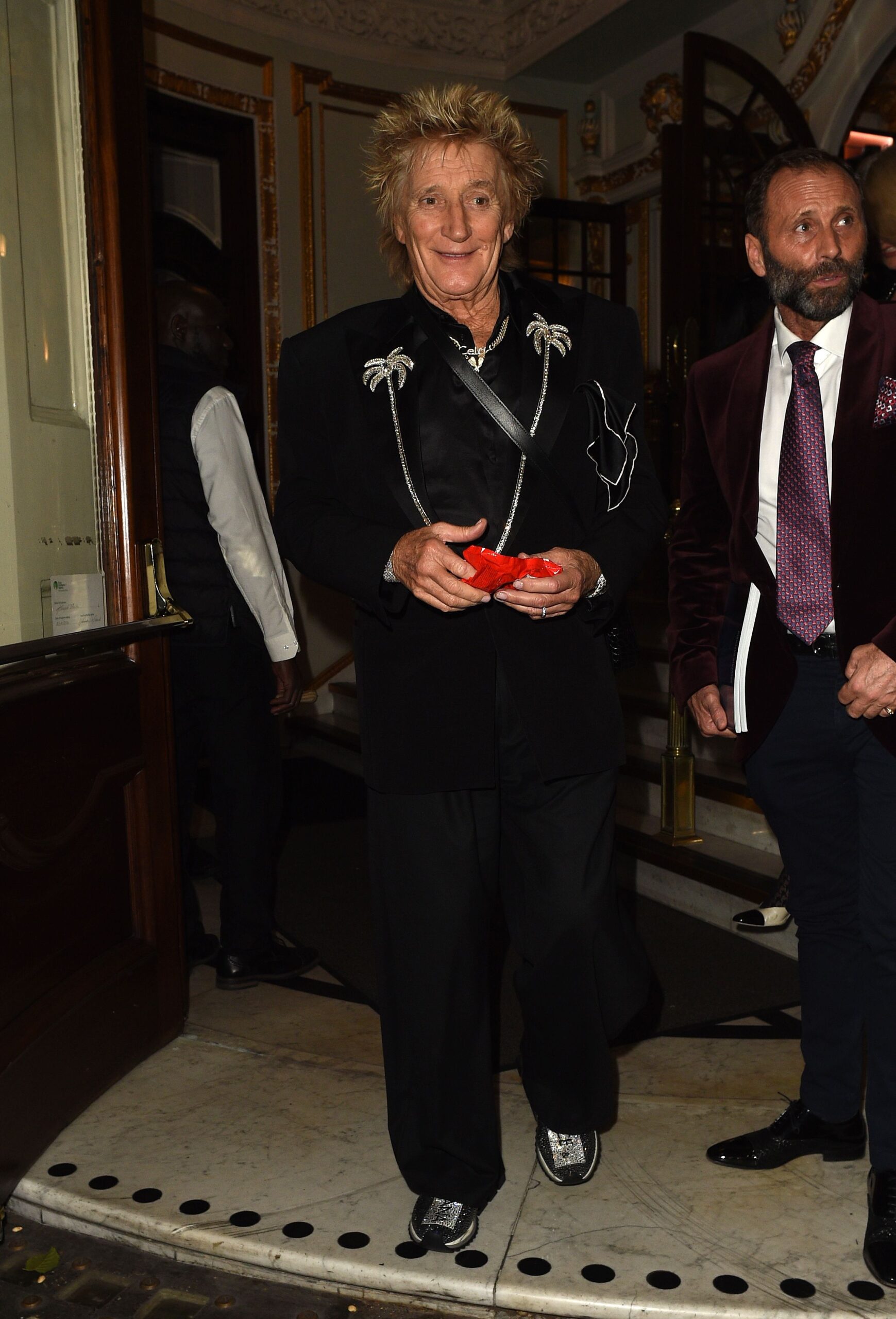 Rod Stewart smiling on evening out