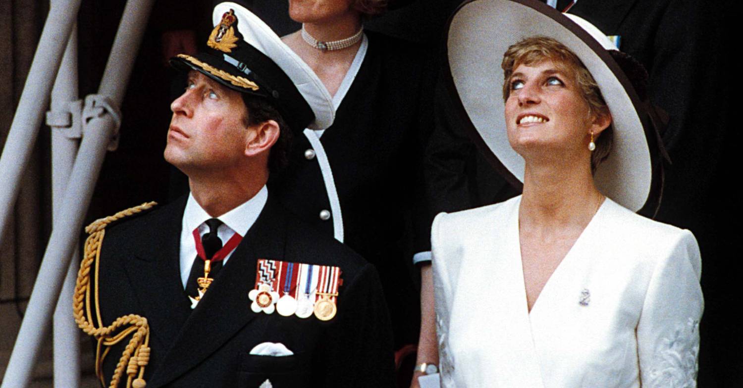 Prince Charles and Princess Diana look upwards