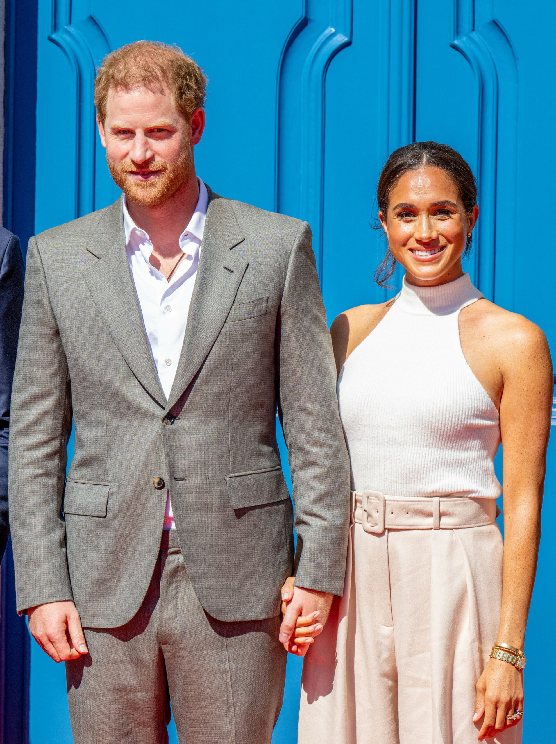 Harry looking at Meghan as she waves on wedding day