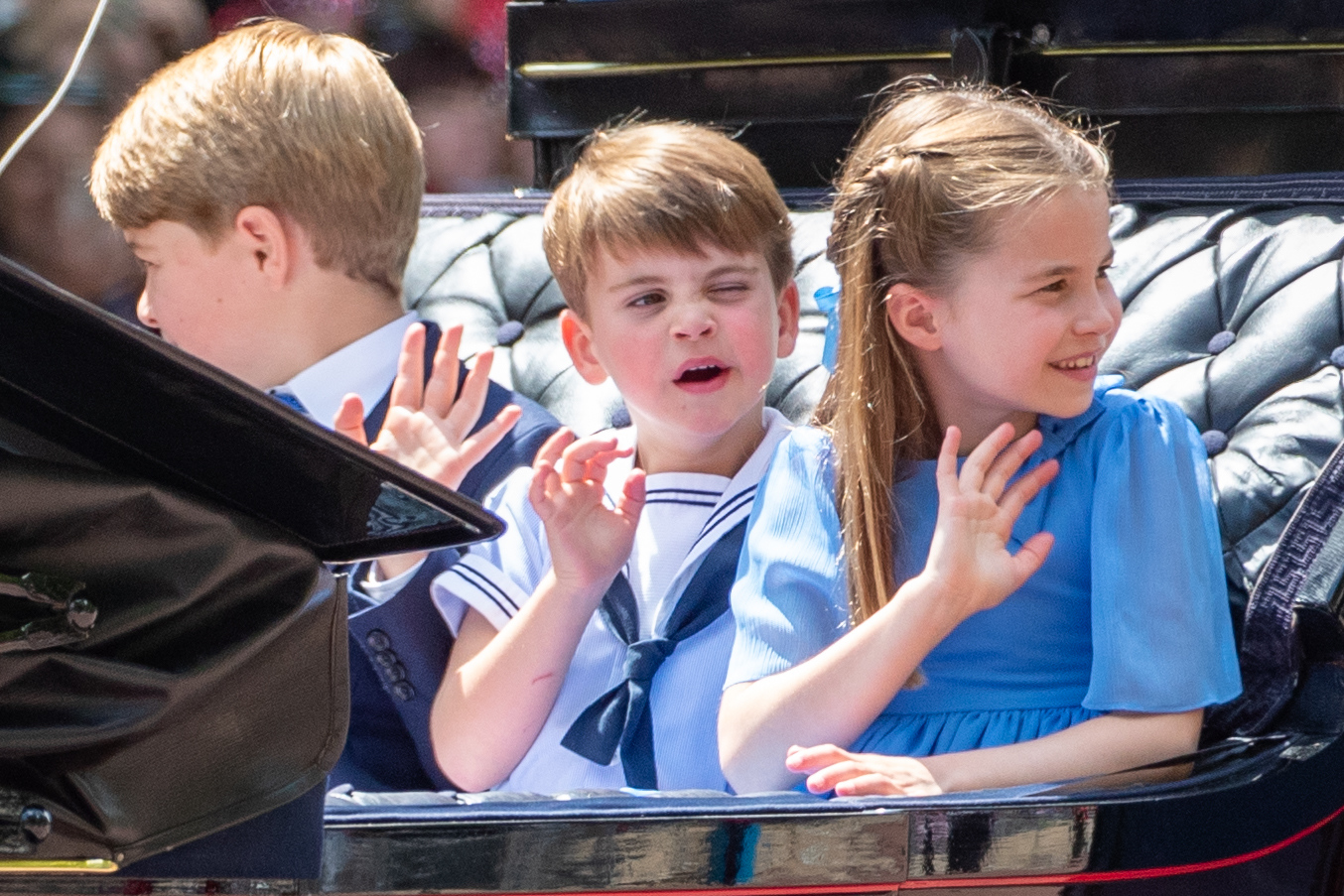 Prince George and Princess Charlotte with Louis waving