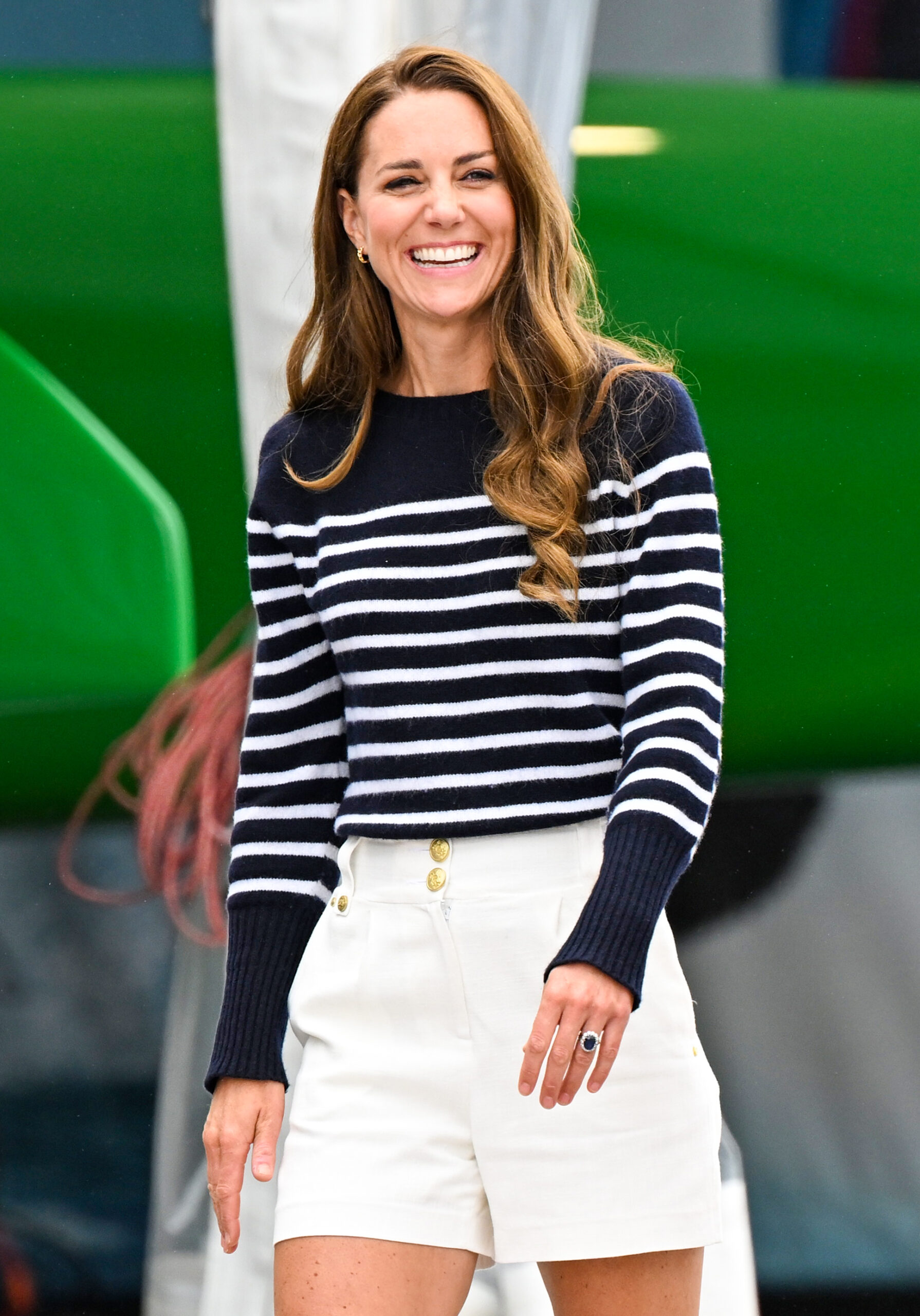 Duchess Kate smiling wearing shorts