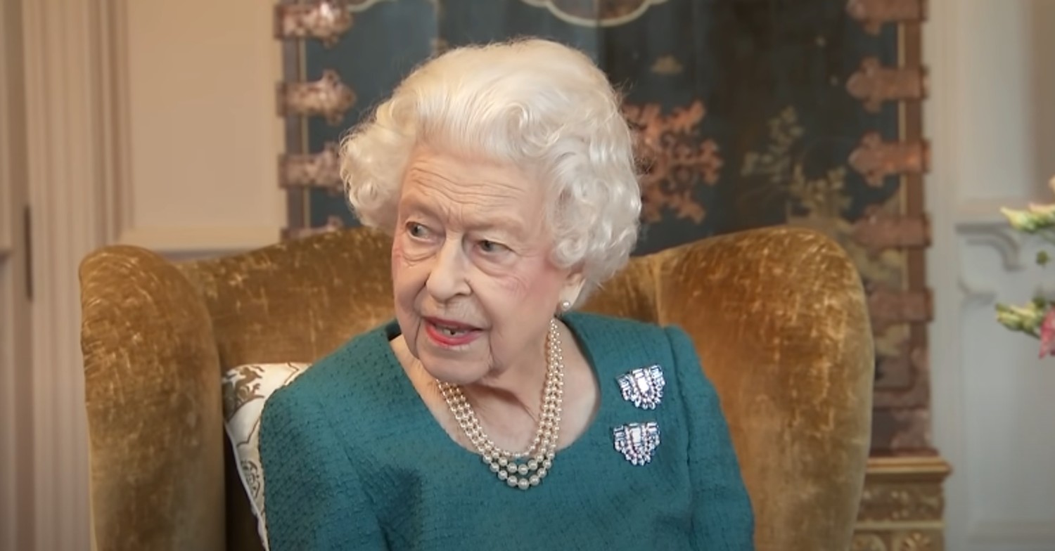 The Queen in teal green dress 