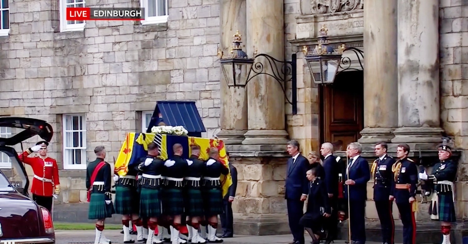 Princess Anne curtseys as Queen Elizabeth II's coffin passes