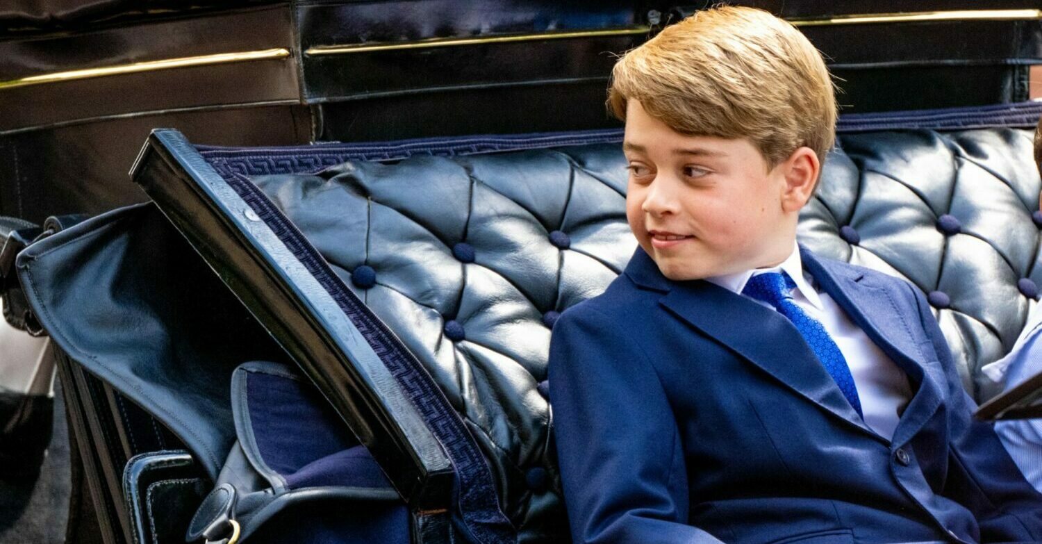 Prince George looking cheeky as he looks at the crowds. 