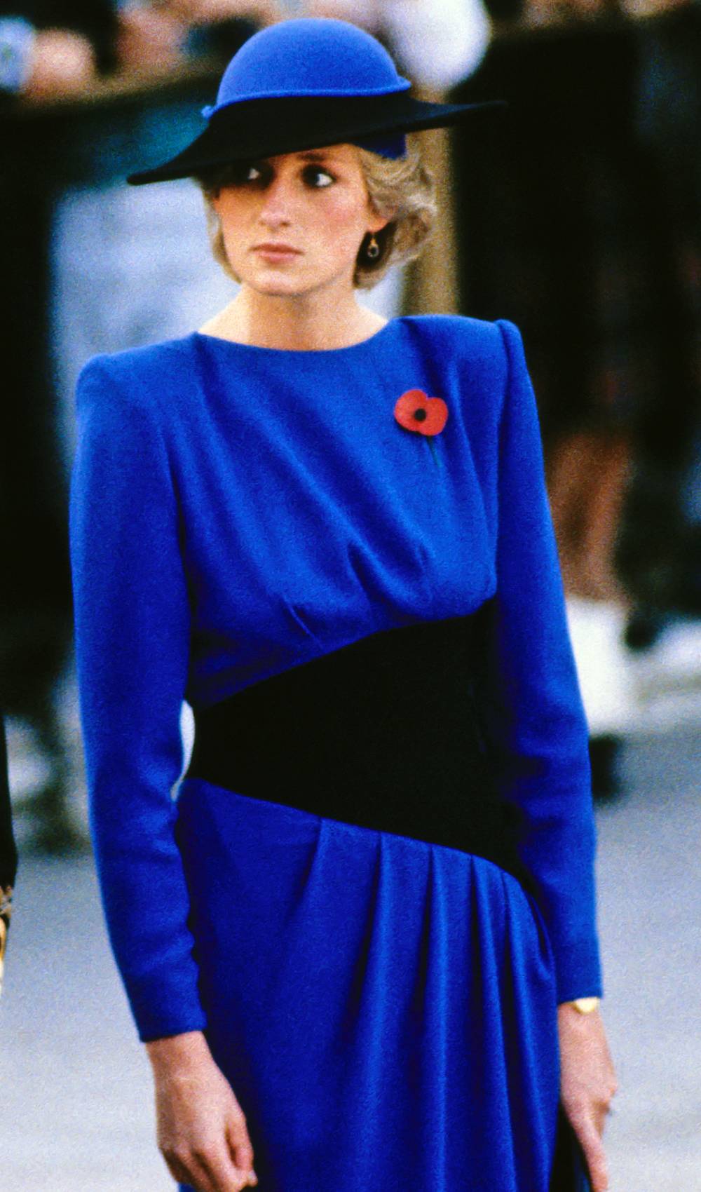 Princess Diana smiles as she steps out in front of cameras